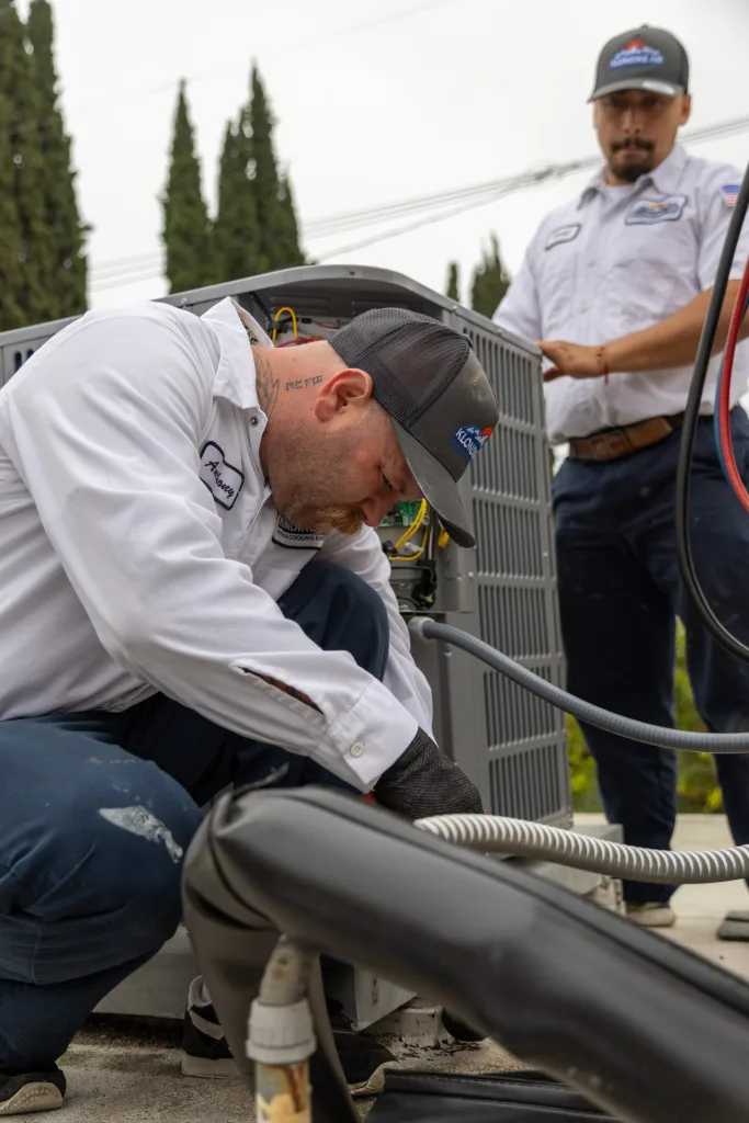Technician Installing an Air Conditioning Unit