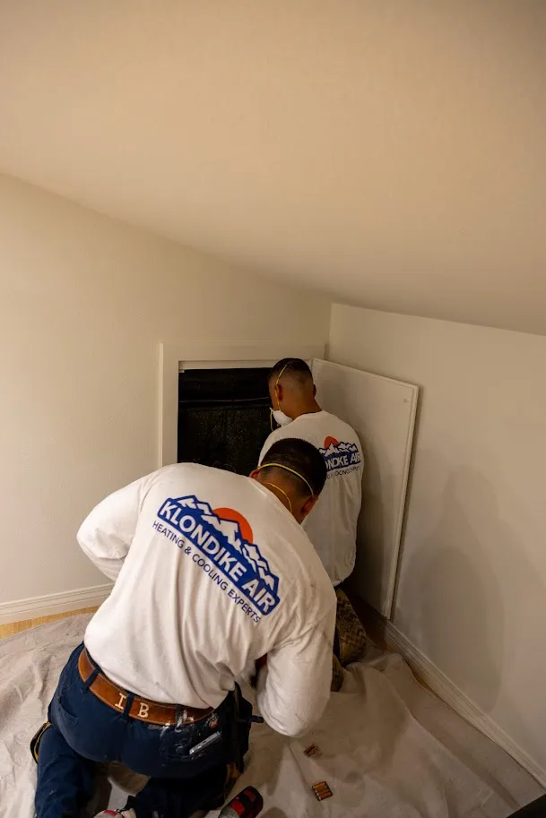 Technician Checking Heating Duck