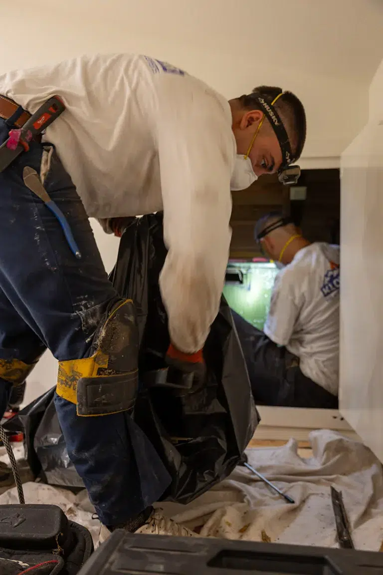 Technicians Cleaning AC Vent