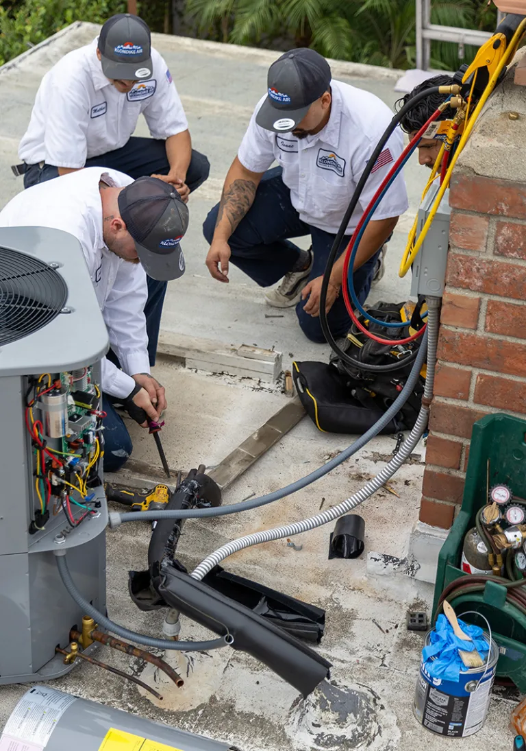 HVAC Technicians Installing a Ducted HVAC System