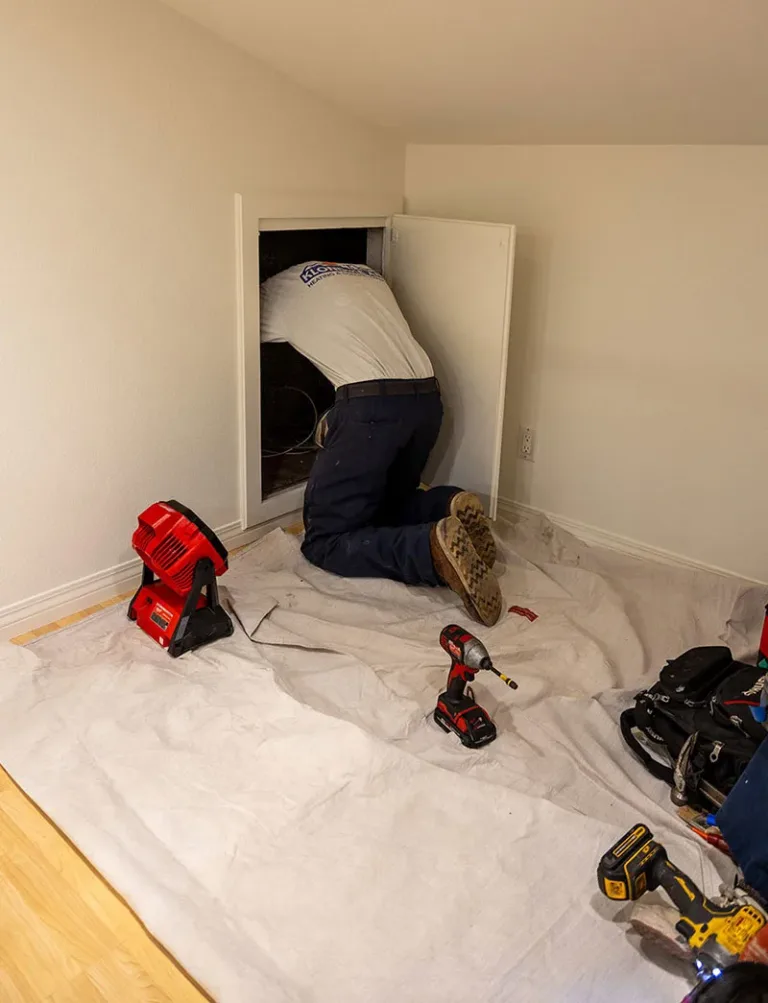 Technician Inspecting HVAC Unit