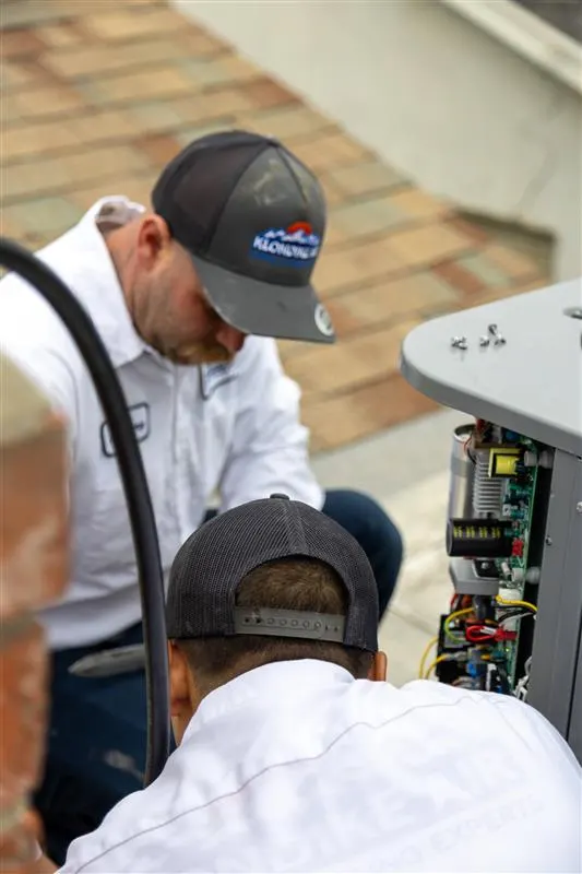 Technician Performing HVAC Repair Service in Orange County Home