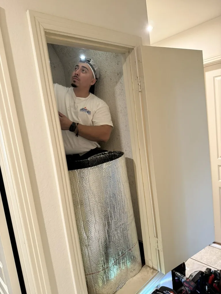 HVAC Technician Inspecting AC Ductwork