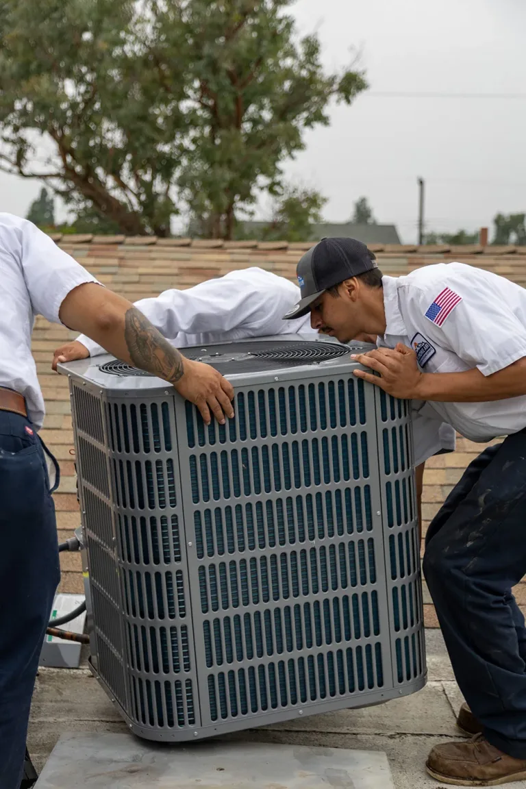 HVAC Technician Replacing HVAC Unit in Irvine